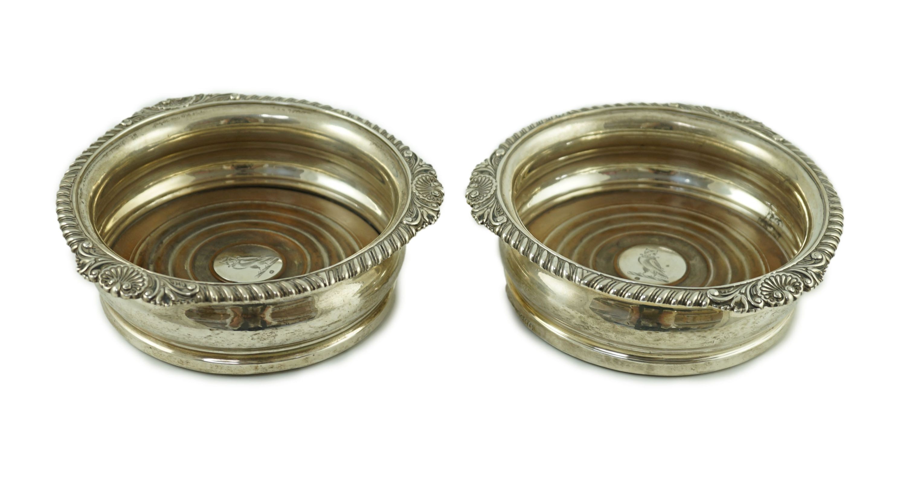 A pair of George IV silver wine coasters by Benjamin Smith III
